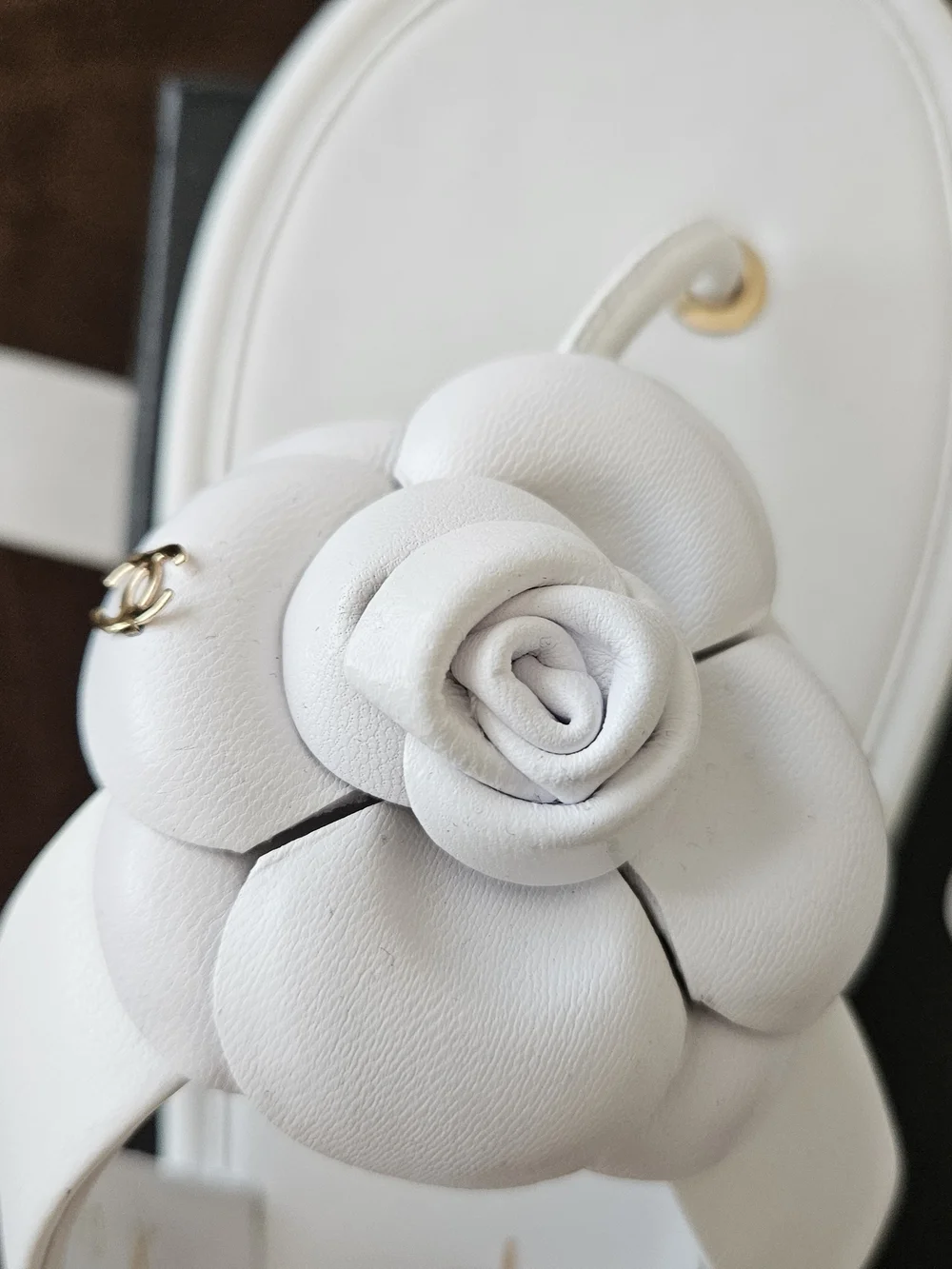 CHANEL White Camellia Leather Slide Sandals with Gold Eyelets